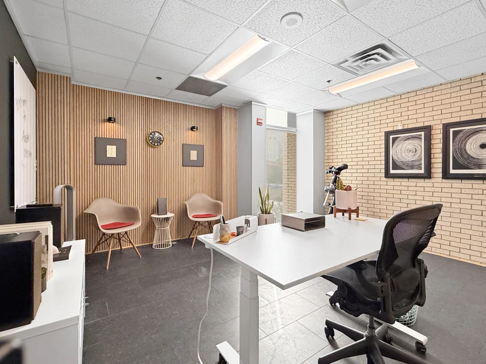 Office with brick feature wall