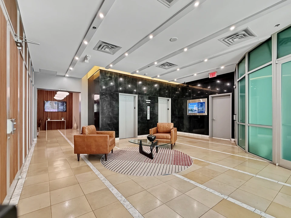 Ground-floor lobby seating and elevators at 1011