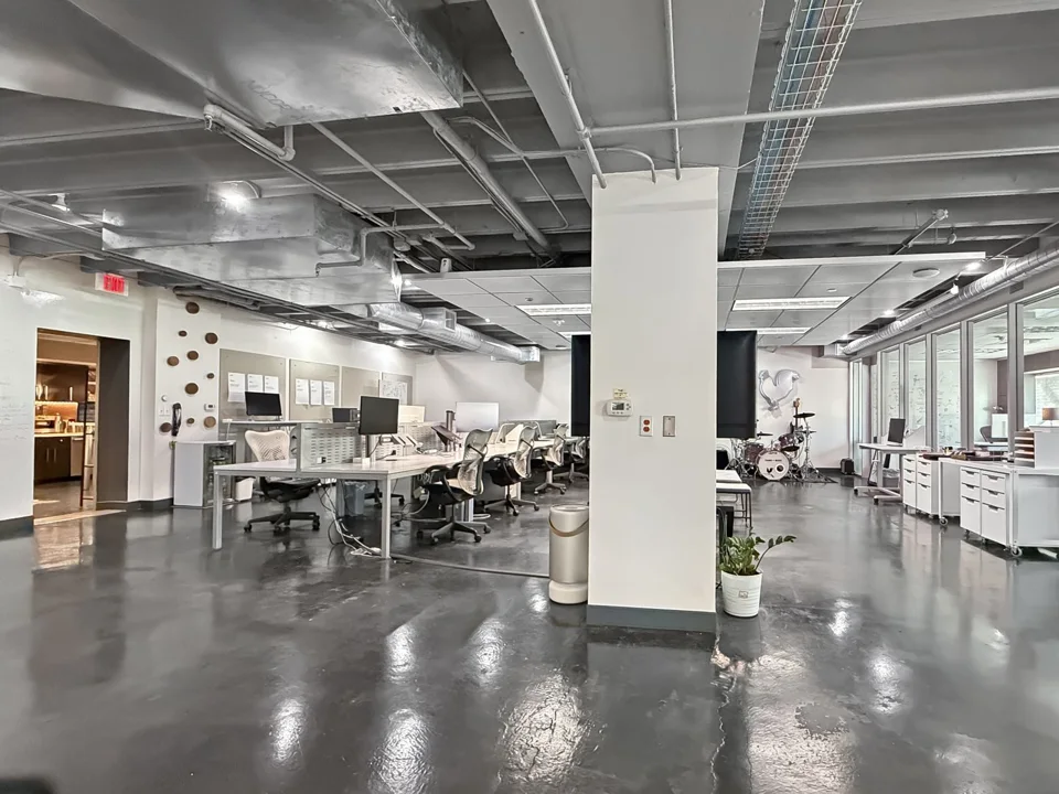 Open office and exposed ceiling in Suite 202